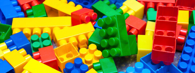 Fototapeta na wymiar plastic children's designer cubes, selective focus