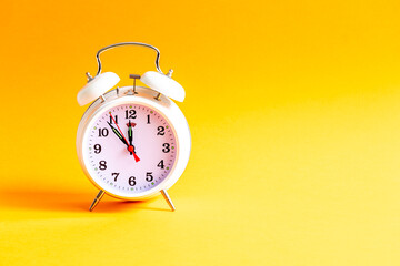 alarm clock on a color background