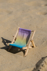 Sunny holidays on the beach sand beach accessories. Sun lounger stand sea. Wooden beach chairs....