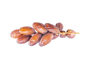 Small fresh bunch of Algerian dates on stalk isolated on white background. Close-up macro photography studio flash lights shot.