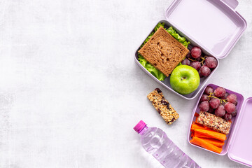 Healthy lunch boxes with sandwich and fruits. Healthy school meal