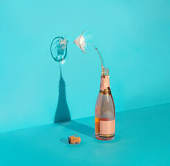 Concept art with Champagne bottle and glass. Minimal art direction with a party or celebration theme. - 587029645