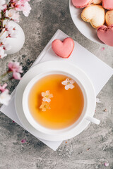Tea with cherry blossom petals - Sakura tea in white cup