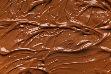 Chocolate background. Melted chocolate. Chocolate swirl.