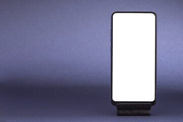 Smartphone with grey empty screen mock up on blue background