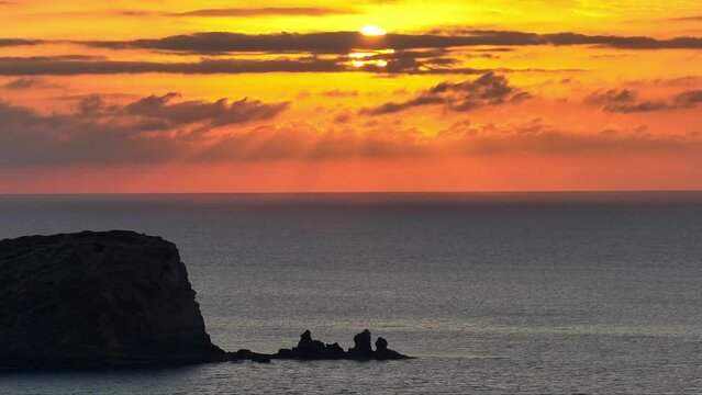 Aerial images of the sunset on the coast of Ibiza. Islets in front of Cala Compte.