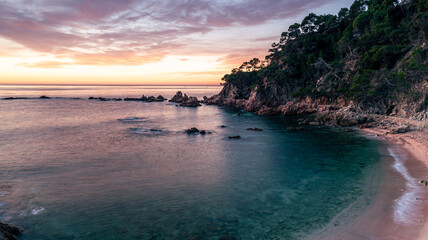 Fototapeta na wymiar Colorful sunrise at the Mediterranean Sea (Costa Brava, Esculls de Canyet, Spain)