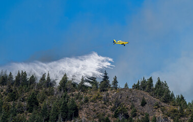 hydrant plane fights fires. Helicopter works on the fires
