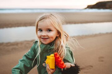 Child girl walking on the beach outdoor family lifestyle vacations girl happy smiling playing with...