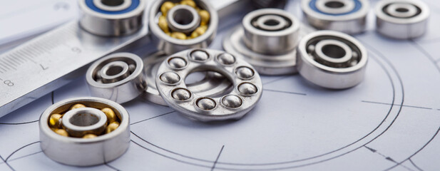 bearings of different types, micrometer, caliper and ruler on the drawings of technical products....
