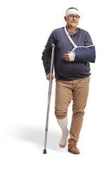 Full length portrait of a mature man with a broken arm and bandage on head