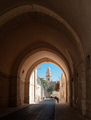 Jerusalem: narrow streets of Old City, arches, tower of Abbey of the dormition