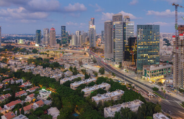 Tel Aviv-Yafo, Israel - September 23, 2020: Tel Aviv and Ramat Gan aerial evening view. Modern skyscrapers and green dormitory quaters