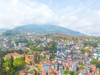 Aerial view of landscape at the hill town in Sapa city, Lao Cai Province, Vietnam in Asia with the sunny light and sunset, mountain view in the clouds