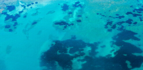 Fototapeta na wymiar Aerial view of the turquoise surface of the Caribbean sea. Ideal for textures and patterns.