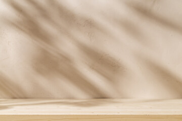 Wood table mockup on stucco background with leaves shadows on the wall. Mock up for branding products, presentation and health care.	
