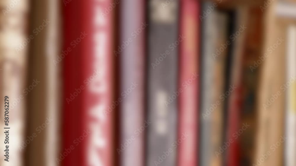 Poster blurred background old vintage books stand in a row on a bookshelf in home. books on bookshelves in 