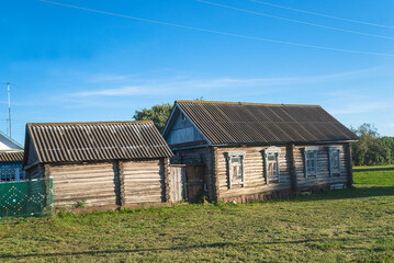 Old wooden russian house on the sunny summer day