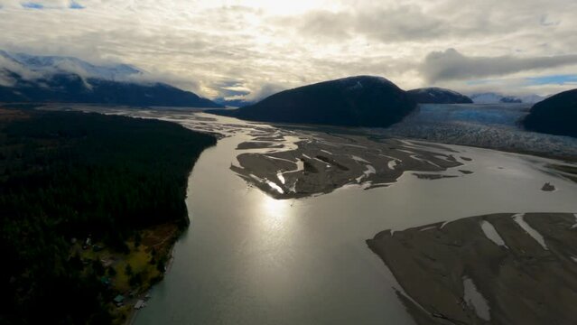 Sunny Soar Aerial View Overhead Glistening Taku River's Till &  Taku Glacier, Alaska USA
