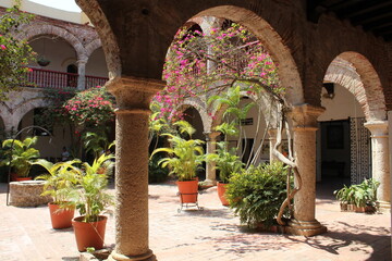 Interior square courtyard with trees, flowers, arches Convent (Convento) of Santa Cruz de la Popa Cartagena Colombia