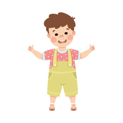 Cute cheerful little boy showing thumb up gesture with both hands. Happy brown haired boy dressed jumpsuit standing with open arms cartoon vector illustration