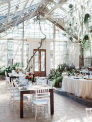 Decor for a fun banquet in a greenhouse. Glass stele, roslins hang down. Bottom line of the wedding.