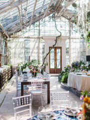 Decor for a fun banquet in a greenhouse. Glass stele, roslins hang down. Bottom line of the wedding.