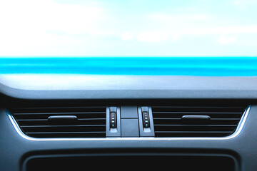 Modern car air vent front look against blue sky. Template for car accessories with air vent...