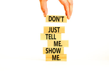 Tell or show symbol. Concept words Do not just tell me, show me on wooden blocks. Beautiful white...