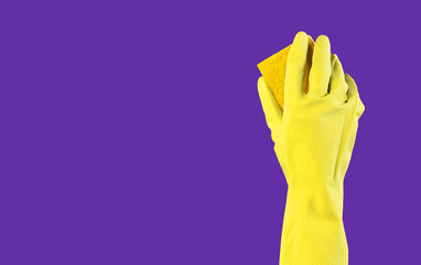 Yellow washing sponge in hand in glove on purple violet background, ad banner for professional cleaning service