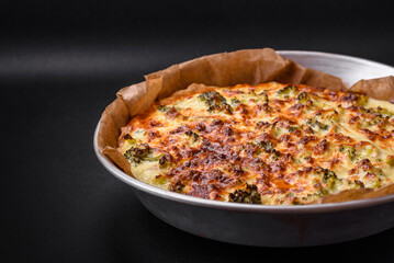 Delicious quiche with broccoli, cheese, chicken, spices and herbs