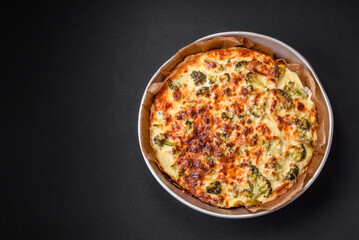 Delicious quiche with broccoli, cheese, chicken, spices and herbs