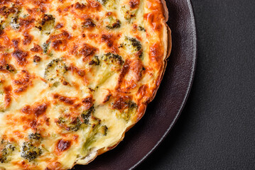 Delicious quiche with broccoli, cheese, chicken, spices and herbs
