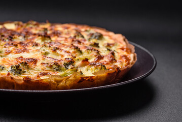 Delicious quiche with broccoli, cheese, chicken, spices and herbs