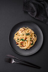Delicious pasta with spinach, sun dried tomatoes, cheese, onions