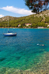 Naklejka na ściany i meble Sailboat in a beautiful Adriatic bay
