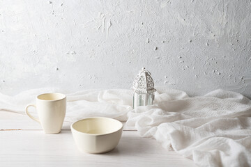 white kitchenware of a mug and a bowl on white background
