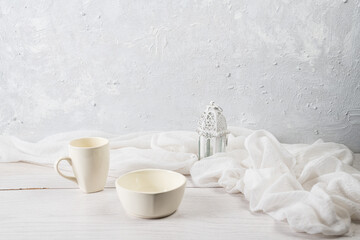 Obraz na płótnie Canvas white kitchenware of a mug and a bowl on white background 