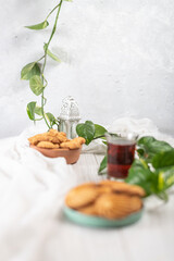 English tea and biscuits on a white wooden background
