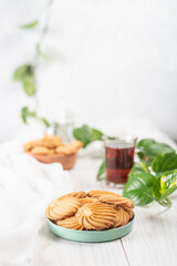 English tea and biscuits on a white wooden background
