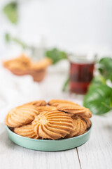 English tea and biscuits on a white wooden background
