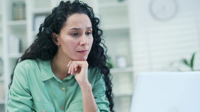 Thoughtful serious worker work on laptop computer in moderm office or home Creative designer architect or freelancer think solving problem look for inspiration feeling lack of ideas at workplace 