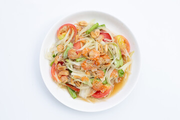 Dish of spicy papaya salad on white.