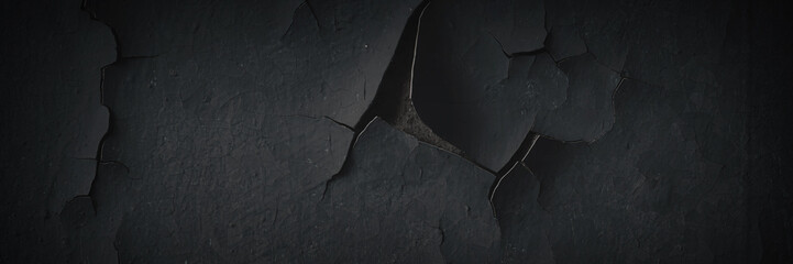 Dark wide panoramic background. Peeling paint on a concrete wall. Dark grunge texture of old...