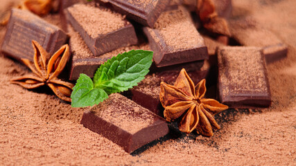 Chocolate. Dark Chocolate Bar Stack and Cocoa Powder with Mint Leafs and Star Anise. Confectionery, Confection Concept