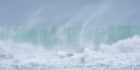 crashing waves off chapel Porth beach Cornwall UK 