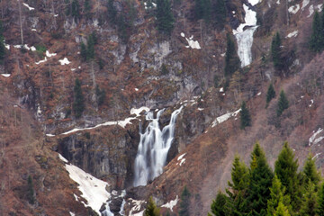 Fototapeta na wymiar waterfall on the hillside