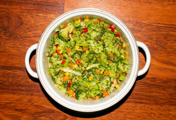 Stewed vegetable mixture.Cauliflower, string beans, carrots, peas and spices.