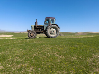 An old soviet machine on the meadow.