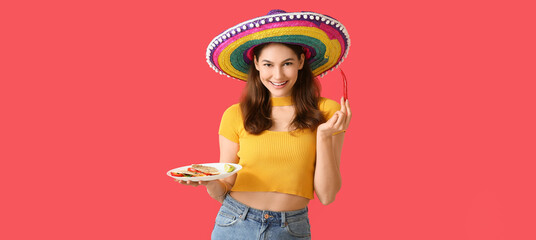 Beautiful young Mexican woman with tasty quesadilla and chili pepper on red background